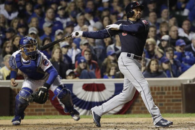 Cleveland Indians' Coco Crisp hits an RBI single during the seventh inning of Game 3 of the Major League Baseball World Series against the Chicago Cubs Friday, Oct. 28, 2016, in Chicago. (AP Photo/David J. Phillip)