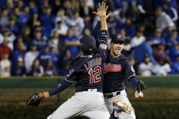 Cleveland Indians' Francisco Lindor (12) and Lonnie Chisenhall (8) celebrate after Game 3 of the Major League Baseball World Series Friday, Oct. 28, 2016, in Chicago. The Indians won 1-0 to take a 2-1 lead in the series. (AP Photo/Nam Y. Huh) Cleveland Indians' Francisco Lindor (12) and Lonnie Chisenhall (8) celebrate after Game 3 of the Major League Baseball World Series Friday, Oct. 28, 2016, in Chicago. The Indians won 1-0 to take a 2-1 lead in the series. (AP Photo/Nam Y. Huh)
