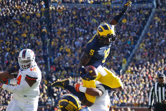 ANN ARBOR, MI - OCTOBER 22:  Jabrill Peppers #5 of the Michigan Wolverines jumps over Julian Jones #2 of the Illinois Fighting Illini during a first quarter run on October 22, 2016 at Michigan Stadium in Ann Arbor, Michigan. (Photo by Gregory Shamus/Getty Images)