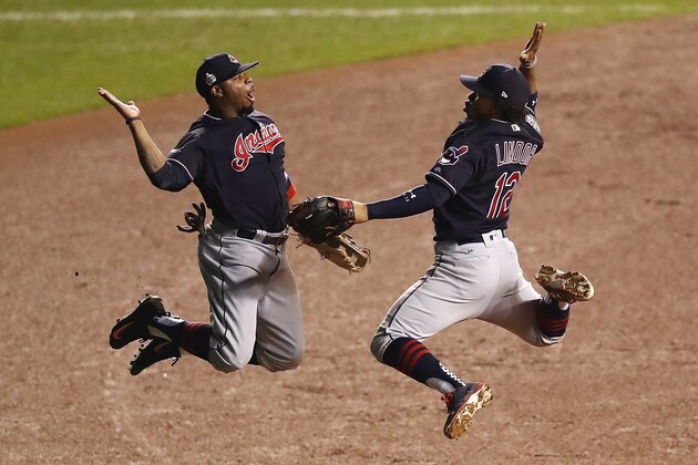 CHICAGO, IL - OCTOBER 28:  Francisco Lindor #12 and Rajai Davis #20 of the Cleveland Indians celebrate after defeating the Chicago Cubs 1-0 in Game Three of the 2016 World Series at Wrigley Field on October 28, 2016 in Chicago, Illinois.  (Photo by Elsa/Getty Images)