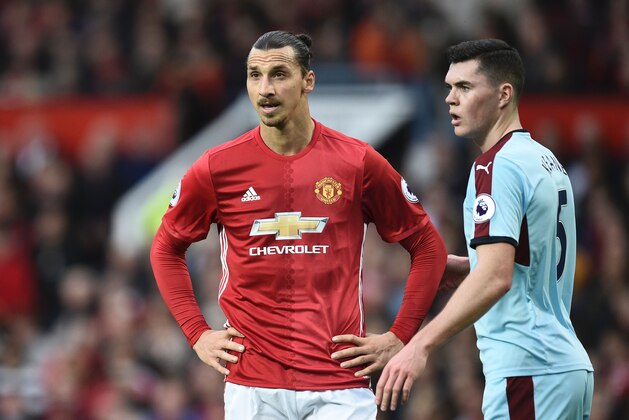 Manchester United's Swedish striker Zlatan Ibrahimovic reacts during the English Premier League football match between Manchester United and Burnley at Old Trafford in Manchester, north west England, on October 29, 2016. / AFP / OLI SCARFF / RESTRICTED TO EDITORIAL USE. No use with unauthorized audio, video, data, fixture lists, club/league logos or 'live' services. Online in-match use limited to 75 images, no video emulation. No use in betting, games or single club/league/player publications.  /         (Photo credit should read OLI SCARFF/AFP/Getty Images)