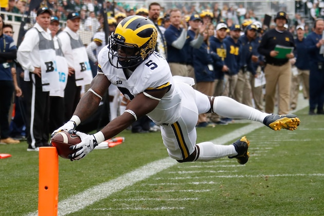 EAST LANSING, MI - OCTOBER 29: Jabrill Peppers #5 of the Michigan Wolverines dives for a first quarter touchdown while playing the Michigan State Spartans at Spartan Stadium on October 29, 2016 in East Lansing, Michigan. (Photo by Gregory Shamus/Getty Images)