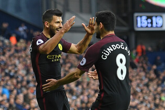 Manchester City's Argentinian striker Sergio Aguero (L) celebrates with Manchester City's German midfielder Ilkay Gundogan after scoring the opening goal of the English Premier League football match between West Bromwich Albion and Manchester City at The Hawthorns stadium in West Bromwich, central England, on October 29, 2016.
 / AFP / Justin TALLIS / RESTRICTED TO EDITORIAL USE. No use with unauthorized audio, video, data, fixture lists, club/league logos or 'live' services. Online in-match use limited to 75 images, no video emulation. No use in betting, games or single club/league/player publications.  /         (Photo credit should read JUSTIN TALLIS/AFP/Getty Images)