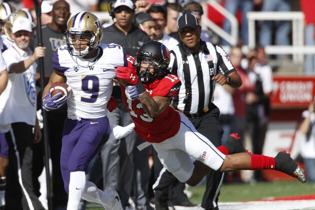 SALT LAKE CITY, UT - OCTOBER 29: Jordan Fogal #13 of the Utah Utes dives to tackle Myles Gaskin #9 of the Washington Huskies during the first half at Rice-Eccles Stadium on October 29, 2016 in Salt Lake City, Utah. (Photo by George Frey/Getty Images)