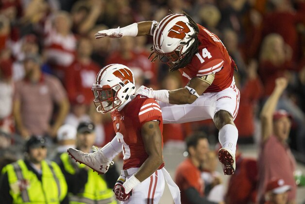 Oct 29, 2016; Madison, WI, USA;  Wisconsin Badgers cornerback Sojourn Shelton (8) is congratulated by safety D'Cota Dixon (14) following an interception during the first quarter against the Nebraska Cornhuskers at Camp Randall Stadium. Mandatory Credit: Jeff Hanisch-USA TODAY Sports