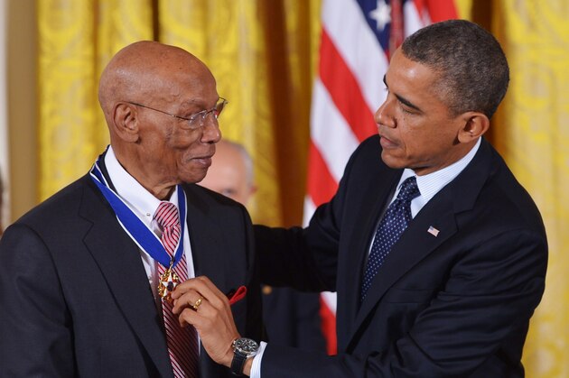 US President Barack Obama presents the Presidential Medal of Freedom to former Chicago Cubs baseball player Ernie Banks during a ceremony in the East Room of the White House on November 20, 2013 in Washington, DC. The Medal of Freedom is the country's highest civilian honor.  AFP PHOTO/Mandel NGAN        (Photo credit should read MANDEL NGAN/AFP/Getty Images)