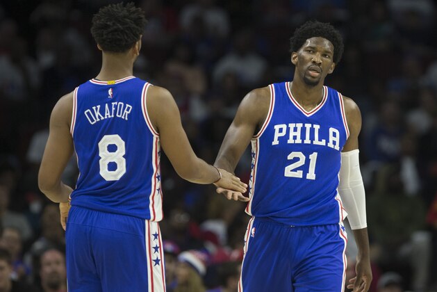 PHILADELPHIA, PA - OCTOBER 26: Jahlil Okafor #8 of the Philadelphia 76ers slaps hands with Joel Embiid #21 against the Oklahoma City Thunder at Wells Fargo Center on October 26, 2016 in Philadelphia, Pennsylvania. NOTE TO USER: User expressly acknowledges and agrees that, by downloading and or using this photograph, User is consenting to the terms and conditions of the Getty Images License Agreement. The Thunder defeated the 76ers 103-97. (Photo by Mitchell Leff/Getty Images)