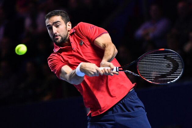 Croatia's Marin Cilic returns a ball to Japan's Kei Nishikori during their final match at the Swiss Indoors ATP 500 tennis tournament on October 30, 2016 in Basel. / AFP / FABRICE COFFRINI        (Photo credit should read FABRICE COFFRINI/AFP/Getty Images)