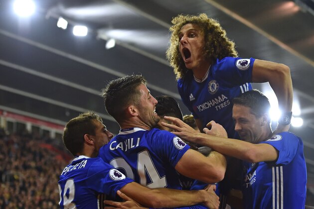 Chelsea's Brazilian defender David Luiz (2R) jumps in to celebrate their second goal scored by Chelsea's Brazilian-born Spanish striker Diego Costa (C obscured) during the English Premier League football match between Southampton and Chelsea at St Mary's Stadium in Southampton, southern England on October 30, 2016. / AFP / GLYN KIRK / RESTRICTED TO EDITORIAL USE. No use with unauthorized audio, video, data, fixture lists, club/league logos or 'live' services. Online in-match use limited to 75 images, no video emulation. No use in betting, games or single club/league/player publications.  /         (Photo credit should read GLYN KIRK/AFP/Getty Images)