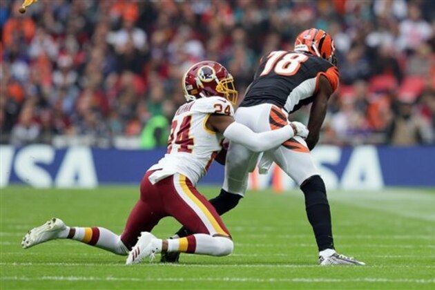 Cincinnati Bengals wide receiver A.J. Green (18) is tackled by Washington Redskins cornerback Josh Norman (24) during an NFL Football game between Cincinnati Bengals and Washington Redskins at Wembley Stadium in London, Sunday Oct. 30, 2016. (AP Photo/Tim Ireland)
