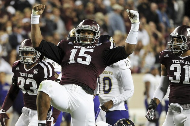 COLLEGE STATION, TX - NOVEMBER 14: Myles Garrett #15 of the Texas A&M Aggies celebrates his tackle of Detrez Newsome #21 of the Western Carolina Catamounts in the first quarter of a NCAA football game at Kyle Field on November 14, 2015 in College Station, Texas. (Photo by Eric Christian Smith/Getty Images)
