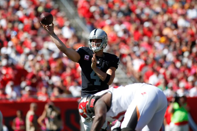 TAMPA, FL - OCTOBER 30:  Quarterback Derek Carr #4 of the Oakland Raiders throws to an open receiver during the first quarter of an NFL game against the Tampa Bay Buccaneers on October 30, 2016 at Raymond James Stadium in Tampa, Florida. (Photo by Brian Blanco/Getty Images)