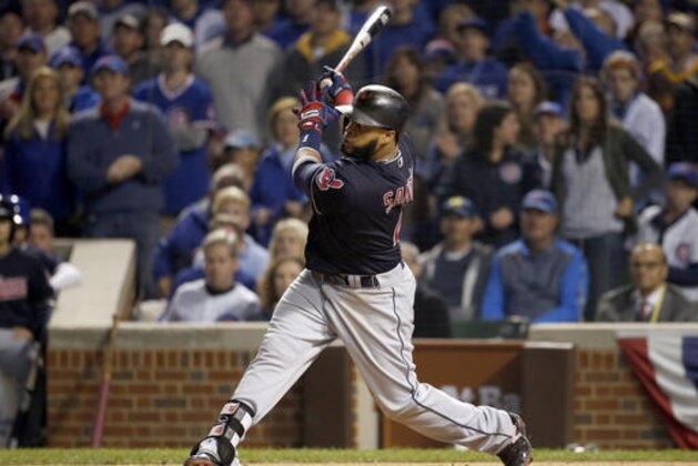 Cleveland Indians' Carlos Santana hits a home run during the second inning of Game 4 of the Major League Baseball World Series against the Chicago Cubs, Saturday, Oct. 29, 2016, in Chicago. (AP Photo/Nam Y. Huh)