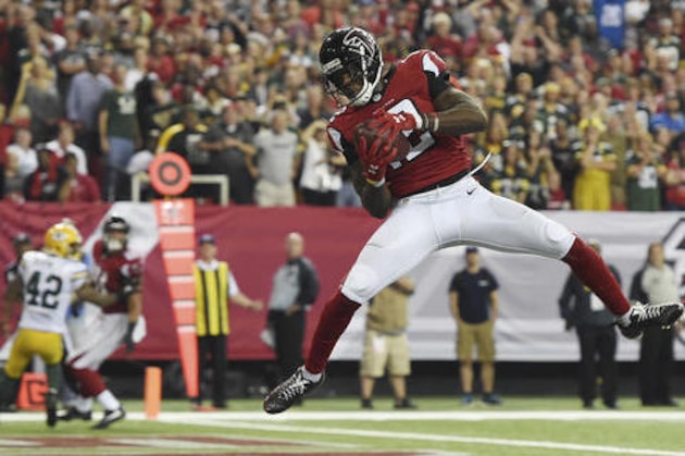 Atlanta Falcons wide receiver Mohamed Sanu (12) makes a touchdown catch against the Green Bay Packers during the second of an NFL football game, Sunday, Oct. 30, 2016, in Atlanta. The Atlanta Falcons won 33-32. (AP Photo/Rainier Ehrhardt)