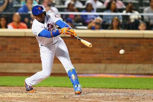 NEW YORK, NEW YORK - SEPTEMBER 22:  Yoenis Cespedes #52 of the New York Mets hits a RBI single in the fifth inning against the Philadelphia Phillies at Citi Field on September 22, 2016 in the Flushing neighborhood of the Queens borough of New York City.  (Photo by Mike Stobe/Getty Images)