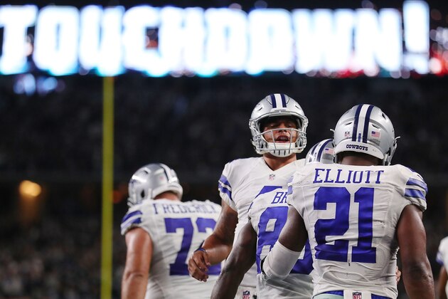 ARLINGTON, TX - OCTOBER 30:  Dak Prescott #4 of the Dallas Cowboys celebrates with Dez Bryant #88 and Ezekiel Elliott #21 after scoring in the fourth quarter during a game between the Dallas Cowboys and the Philadelphia Eagles at AT&T Stadium on October 30, 2016 in Arlington, Texas.  (Photo by Tom Pennington/Getty Images)