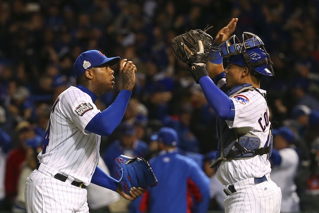 Oct 30, 2016; Chicago, IL, USA; Chicago Cubs relief pitcher Aroldis Chapman (left) celebrates with catcher Willson Contreras (right) after game five of the 2016 World Series against the Cleveland Indians at Wrigley Field. The Cubs defeated the Indians 3-2. Mandatory Credit: Jerry Lai-USA TODAY Sports
