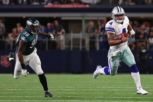 ARLINGTON, TX - OCTOBER 30: Dak Prescott #4 of the Dallas Cowboys avoids the tackle of Marcus Smith #90 of the Philadelphia Eagles in the fourth quarter during a game between the Dallas Cowboys and the Philadelphia Eagles at AT&T Stadium on October 30, 2016 in Arlington, Texas.  (Photo by Tom Pennington/Getty Images)