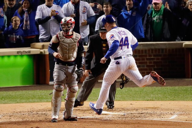 CHICAGO, IL - OCTOBER 30:  Anthony Rizzo #44 of the Chicago Cubs scores a run past Roberto Perez #55 of the Cleveland Indians in the fourth inning in Game Five of the 2016 World Series at Wrigley Field on October 30, 2016 in Chicago, Illinois.  (Photo by Jamie Squire/Getty Images)