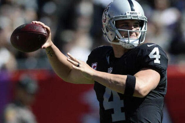Oakland Raiders quarterback Derek Carr (4) throws a pass against the Tampa Bay Buccaneers during the first quarter of an NFL football game Sunday, Oct. 30, 2016, in Tampa, Fla. (AP Photo/Jason Behnken)