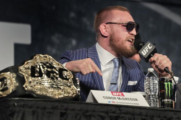 UFC featherweight champion Conor McGregor speaks during a news conference for UFC 205, Tuesday, Sept. 27, 2016, in New York. McGregor will challenge lightweight champion Eddie Alvarez for the lightweight belt on Nov. 12 in what will be the first UFC card to be held in New York after the state legislature legalized the sport earlier this year. (AP Photo/Julie Jacobson) UFC featherweight champion Conor McGregor speaks during a news conference for UFC 205, Tuesday, Sept. 27, 2016, in New York. McGregor will challenge lightweight champion Eddie Alvarez for the lightweight belt on Nov. 12 in what will be the first UFC card to be held in New York after the state legislature legalized the sport earlier this year. (AP Photo/Julie Jacobson)