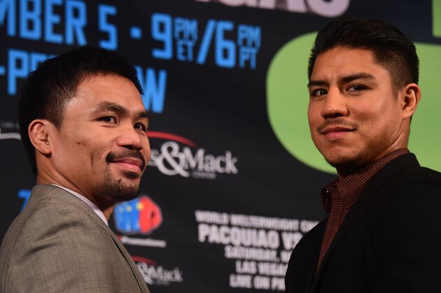 Boxers Manny Pacquiao (L) of the Philippines and Jessie Vargas of the US pose for the cameras at a press conference in Beverly Hills, California, on September 8, 2016, where their November 5th fight was announced.  / AFP / Frederic J. BROWN        (Photo credit should read FREDERIC J. BROWN/AFP/Getty Images)