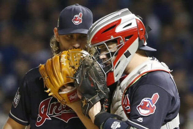 Cleveland Indians starting pitcher Josh Tomlin talks to catcher Roberto Perez during the second inning of Game 3 of the Major League Baseball World Series Friday, Oct. 28, 2016, in Chicago. (AP Photo/Nam Y. Huh)