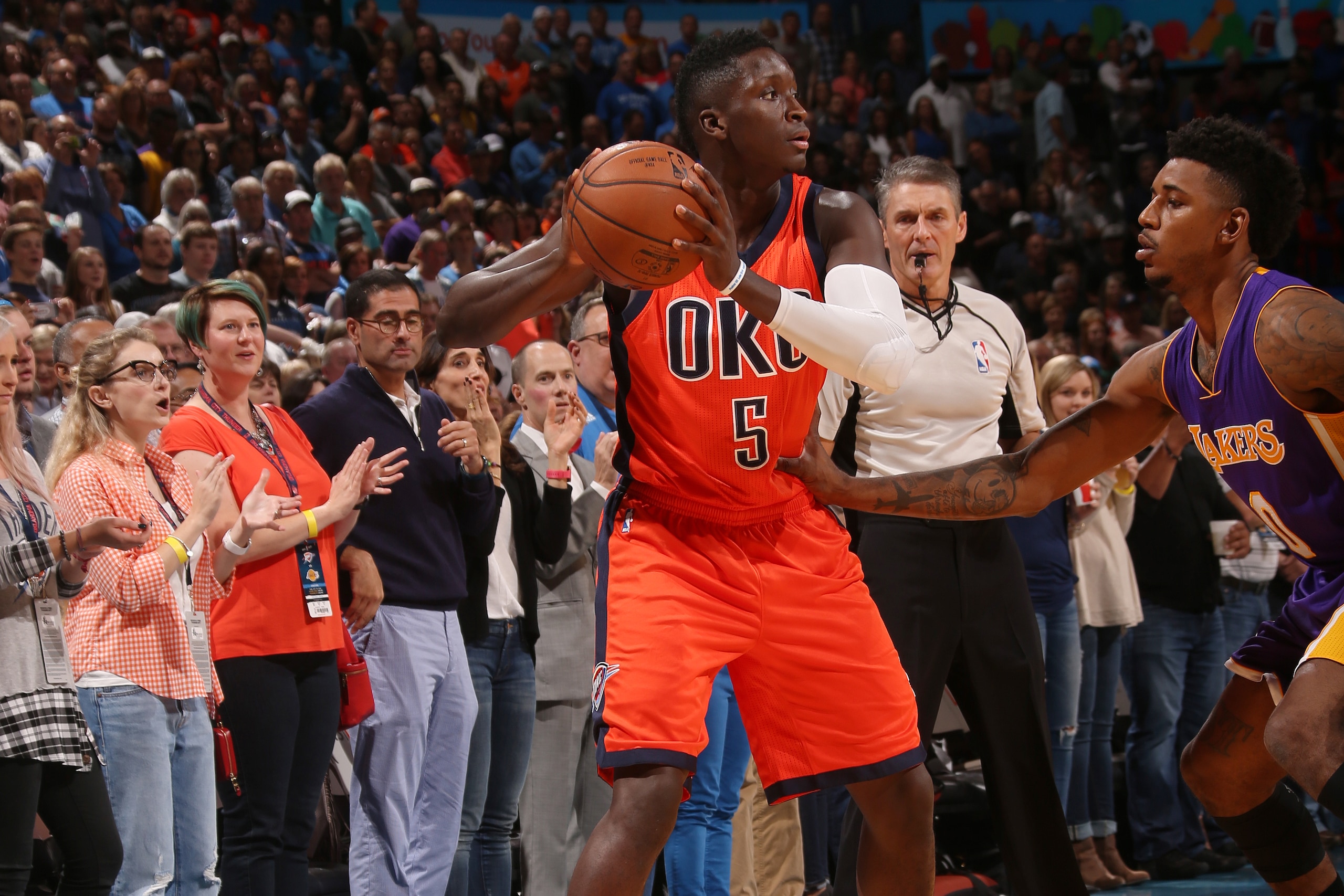 OKLAHOMA CITY, OK - OCTOBER 30: Victor Oladipo #5 of the Oklahoma City Thunder looks to pass against the Los Angeles Lakers on October 30, 2016 at Chesapeake Energy Arena in Oklahoma City, Oklahoma. NOTE TO USER: User expressly acknowledges and agrees that, by downloading and or using this photograph, User is consenting to the terms and conditions of the Getty Images License Agreement. Mandatory Copyright Notice: Copyright 2016 NBAE (Photo by Layne Murdoch/NBAE via Getty Images)