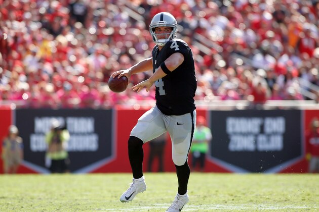 TAMPA, FL - OCTOBER 30:  Quarterback Derek Carr #4 of the Oakland Raiders looks for an open receiver during the fourth quarter of an NFL game against the Tampa Bay Buccaneers on October 30, 2016 at Raymond James Stadium in Tampa, Florida. (Photo by Brian Blanco/Getty Images)