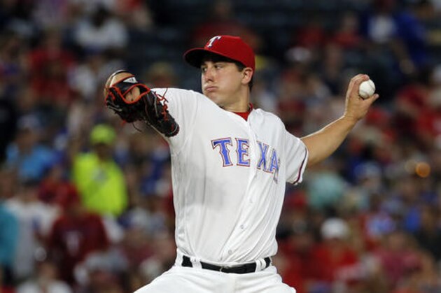Texas Rangers starting pitcher Derek Holland (45) throws to the Los Angeles Angels in the second inning of a baseball game, Wednesday, Sept. 21, 2016, in Arlington, Texas. (AP Photo/Tony Gutierrez)
