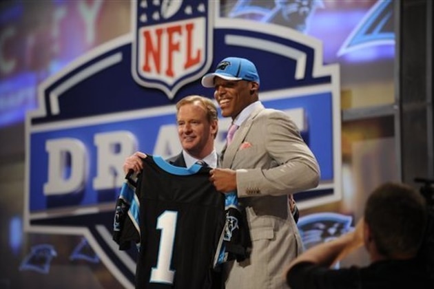 Auburn Quarterback Cam Newton poses for photographs with NFL commission Roger Goodell after he was selected as the first pick overall by the Carolina Panthers in the first round of the NFL football draft at Radio City Music Hall Thursday, April 28, 2011, in New York. (AP Photo/Stephen Chernin)