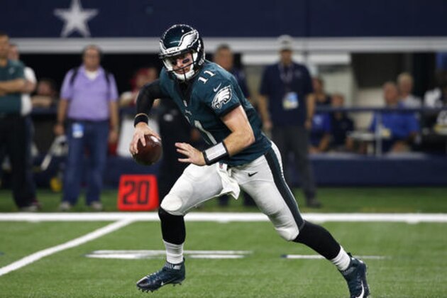 Philadelphia Eagles quarterback Carson Wentz (11) scrambles out of the pocket in the first half of an NFL football game against the Dallas Cowboys on Sunday, Oct. 30, 2016, in Arlington, Texas. (AP Photo/Michael Ainsworth)