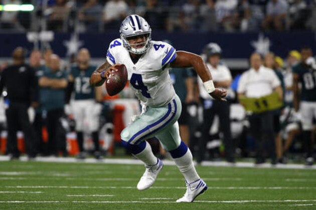 Dallas Cowboys quarterback Dak Prescott (4) scrambles out of the pocket in the second half of an NFL football game against the Philadelphia Eagles on Sunday, Oct. 30, 2016, in Arlington, Texas. (AP Photo/Michael Ainsworth)