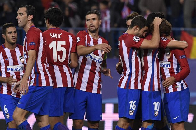 Atletico Madrid's French forward Antoine Griezmann (R) is congratulated by his teammates after scoring during the UEFA Champions League Group D football match Club Atletico de Madrid vs FC Rostov at the Vicente Calderon stadium in Madrid, on November 1, 2016. / AFP / GERARD JULIEN        (Photo credit should read GERARD JULIEN/AFP/Getty Images)