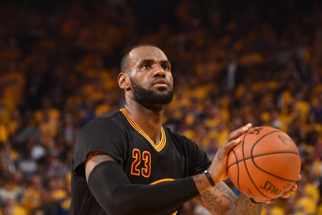 OAKLAND, CA - JUNE 19:  LeBron James #23 of the Cleveland Cavaliers shoots a free throw against the Golden State Warriors in Game Seven of the 2016 NBA Finals on June 19, 2016 at ORACLE Arena in Oakland, California. NOTE TO USER: User expressly acknowledges and agrees that, by downloading and/or using this Photograph, user is consenting to the terms and conditions of the Getty Images License Agreement. Mandatory Copyright Notice: Copyright 2016 NBAE (Photo by Andrew D. Bernstein/NBAE via Getty Images)