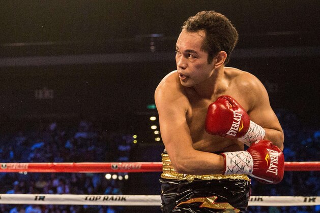 Nonito Donaire of the Philippines (R) punches France's Anthony Settoul (L) during their super bantamweight boxing fight at the Venetian's Cotai Arena in Macau on July 18, 2015. AFP PHOTO / ANTHONY WALLACE        (Photo credit should read ANTHONY WALLACE/AFP/Getty Images)