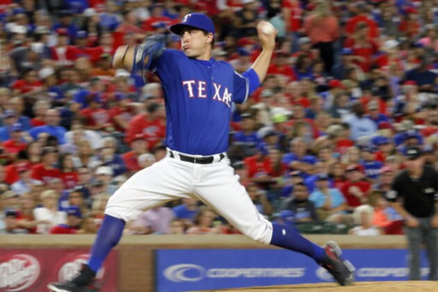 Texas Rangers relief pitcher Derek Holland throws to the Tampa Bay Rays during the eighth inning of a baseball game against the Tampa Bay Rays on Saturday, Oct. 1, 2016, in Arlington, Texas. The Rays won 4-1. (AP Photo/Tony Gutierrez)
