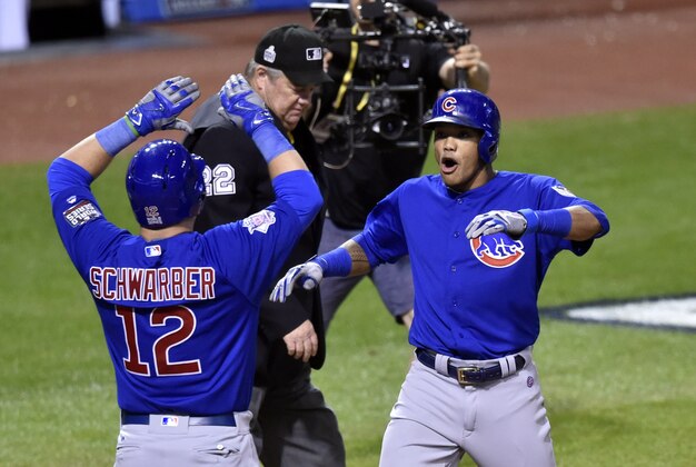 Nov 1, 2016; Cleveland, OH, USA; Chicago Cubs shortstop Addison Russell celebrates with player Kyle Schwarber (12) after hitting a grand slam against the Cleveland Indians in the third inning in game six of the 2016 World Series at Progressive Field. Mandatory Credit: David Richard-USA TODAY Sports