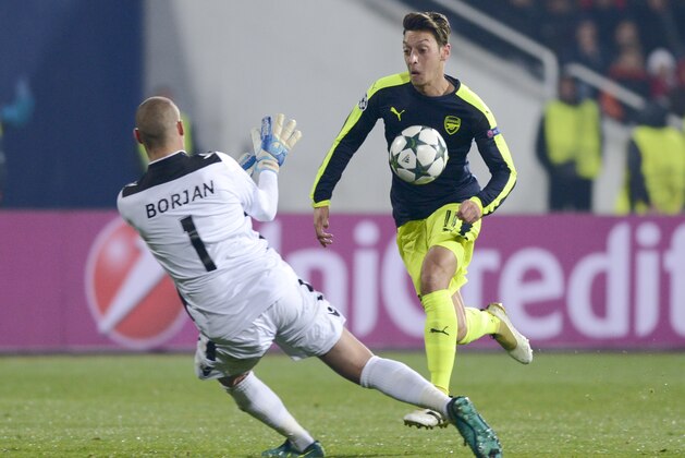 Arsenals German midfielder Mesut Ozil drives the ball before scoring a goal during the UEFA Champions League Group A football match between PFC Ludogorets and Arsenal, on November 1, 2016 at the Vassil Levski stadium in Sofia.  / AFP / NIKOLAY DOYCHINOV        (Photo credit should read NIKOLAY DOYCHINOV/AFP/Getty Images)