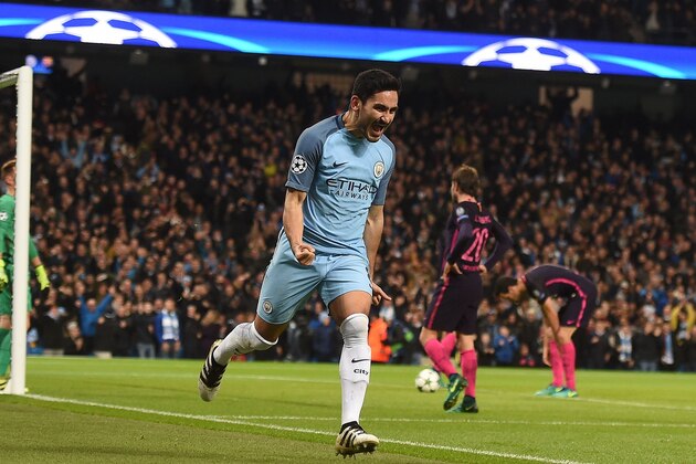 Manchester City's German midfielder Ilkay Gundogan celebrates scoring his team's first goal during the UEFA Champions League group C football match between Manchester City and Barcelona at the Etihad Stadium in Manchester, north west England on November 1, 2016. / AFP / PAUL ELLIS        (Photo credit should read PAUL ELLIS/AFP/Getty Images)