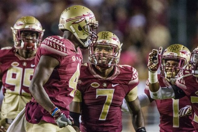 Florida State's Ryan Green (7) and teammates celebrate with running back Dalvin Cook after a Cook touchdown in the second half of an NCAA college football game against Clemson in Tallahassee, Fla., Saturday, Oct. 29, 2016. Clemson defeated Florida State 37-34. (AP Photo/Mark Wallheiser)