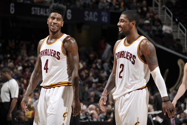 CLEVELAND, OH - FEBRUARY 8:  Iman Shumpert #4 of the Cleveland Cavaliers and Kyrie Irving #2 of the Cleveland Cavaliers during the game against the Sacramento Kings on February 8, 2016 at Quicken Loans Arena in Cleveland, Ohio. NOTE TO USER: User expressly acknowledges and agrees that, by downloading and/or using this Photograph, user is consenting to the terms and conditions of the Getty Images License Agreement. Mandatory Copyright Notice: Copyright 2016 NBAE  (Photo by David Liam Kyle/NBAE via Getty Images)