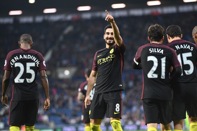 Manchester City's German midfielder Ilkay Gundogan (C) celebrates after scoring their third goal during the English Premier League football match between West Bromwich Albion and Manchester City at The Hawthorns stadium in West Bromwich, central England, on October 29, 2016.

Manchester City won the game 4-0. / AFP / Justin TALLIS / RESTRICTED TO EDITORIAL USE. No use with unauthorized audio, video, data, fixture lists, club/league logos or 'live' services. Online in-match use limited to 75 images, no video emulation. No use in betting, games or single club/league/player publications.  /         (Photo credit should read JUSTIN TALLIS/AFP/Getty Images)
