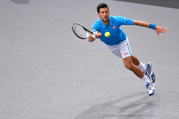 PARIS, FRANCE - NOVEMBER 02:  Novak Djokovic of Serbia plays a forehand during the Men's second round match against Gilles Muller of Luxembourg on day three of the BNP Paribas Masters at Palais Omnisports de Bercy on November 2, 2016 in Paris, France.  (Photo by Aurelien Meunier/Getty Images)