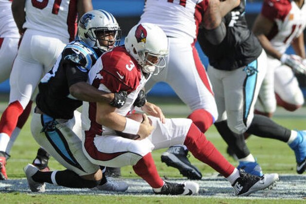 Arizona Cardinals' Carson Palmer (3) is sacked by Carolina Panthers' Leonard Johnson (23) in the second half of an NFL football game in Charlotte, N.C., Sunday, Oct. 30, 2016. (AP Photo/Mike McCarn)