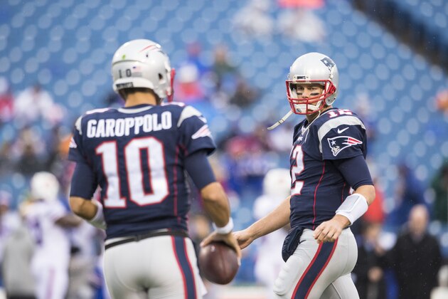 ORCHARD PARK, NY - OCTOBER 30:  Jimmy Garoppolo #10 and Tom Brady #12 of the New England Patriots warms up before the game against the Buffalo Bills on October 30, 2016 at New Era Field in Orchard Park, New York. New England defeats Buffalo 41-25.  (Photo by Brett Carlsen/Getty Images)