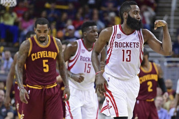 Houston Rockets guard James Harden (13) celebrates after a 3-point basket in the second half of an NBA basketball game against the Cleveland Cavaliers, Tuesday, Nov. 1, 2016, in Cleveland. The Cavaliers won 128-120. (AP Photo/David Dermer)