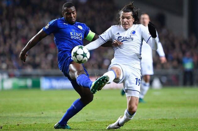 Leicester City's Jamaican defender Wes Morgan (L) vies with FC Copenhagen's Paraguayan forward Federico Santander during the UEFA Champions League group G football match between FC Copenhagen and Leicester City FC at the Telia Parken stadium in Copenhagen on November 2, 2016.  / AFP / JONATHAN NACKSTRAND        (Photo credit should read JONATHAN NACKSTRAND/AFP/Getty Images)