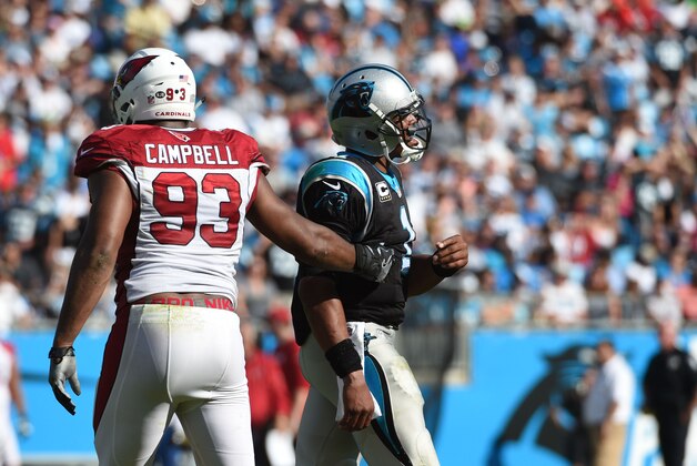 Oct 30, 2016; Charlotte, NC, USA; Arizona Cardinals defensive end Calais Campbell (93) and Carolina Panthers quarterback Cam Newton (1) react in the third quarter at Bank of America Stadium. Mandatory Credit: Bob Donnan-USA TODAY Sports
