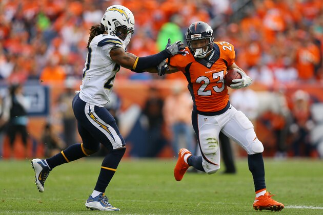 DENVER, CO - OCTOBER 30:  Running back Devontae Booker #23 of the Denver Broncos stiff arms free safety Dwight Lowery #20 of the San Diego Chargers in the second quarter of the game at Sports Authority Field at Mile High on October 30, 2016 in Denver, Colorado. (Photo by Justin Edmonds/Getty Images)